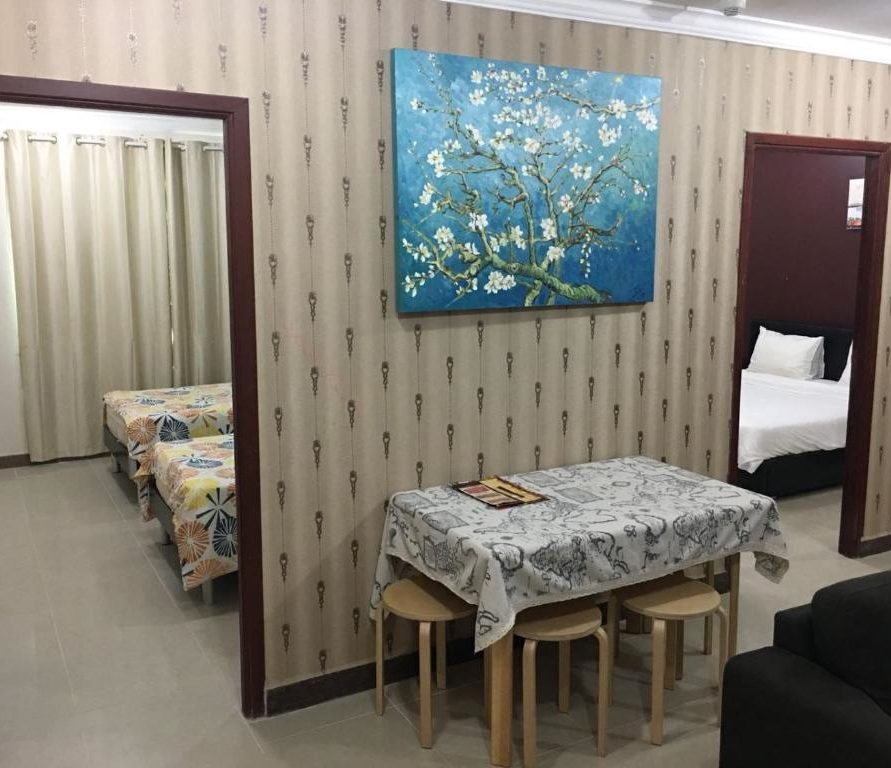 غرف ديلوكس فسيحة مع غرف نوم توأم وكوين - اختبر الراحة المطلقة في فندقنا في مدينة الكويت